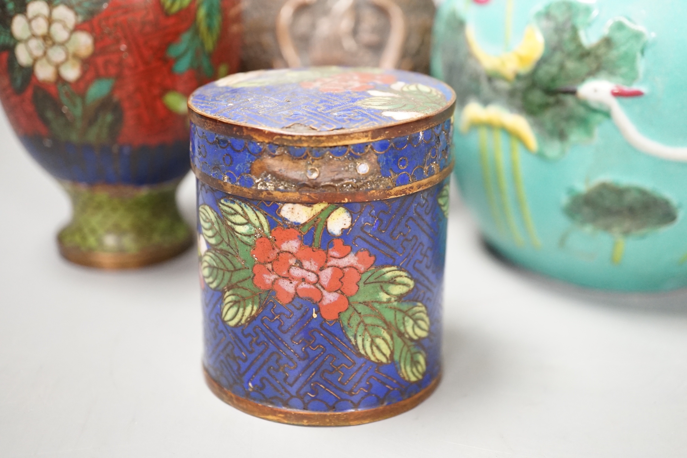 A group of Chinese porcelain vases, a cloisonné enamel vase and pot and a Middle Eastern metal vase, tallest 23 cm